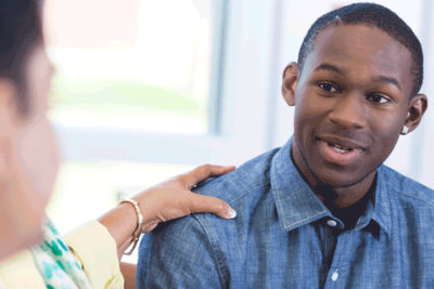 psychologist comforting the man